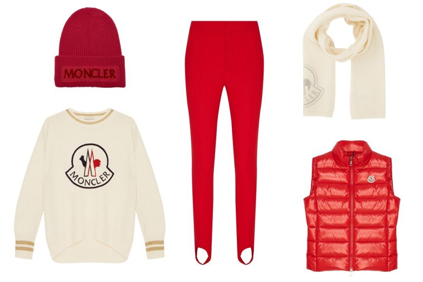 Moncler: белый джемпер с золотистой отделкой, шерстяная розовая шапка, красные брюки со штрипками, белый шарф с логотипом, стеганый жилет